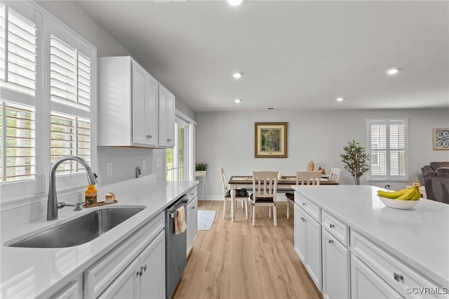 8106 W Danube Loop, New Kent, VA 23124 - kitchen featuring a sink, stainless steel dishwasher, recessed lighting, light wood finished floors, and light countertops