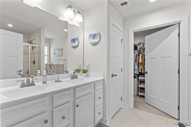 8106 W Danube Loop, New Kent, VA 23124 - full bath featuring a stall shower, tile patterned flooring, double vanity, recessed lighting, and a spacious closet