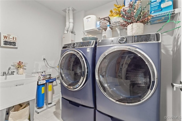 8106 W Danube Loop, New Kent, VA 23124 - laundry room with independent washer and dryer and tile patterned flooring