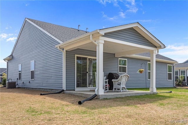 8106 W Danube Loop, New Kent, VA 23124 - rear view of house with central AC unit, a yard, a patio area, and roof with shingles