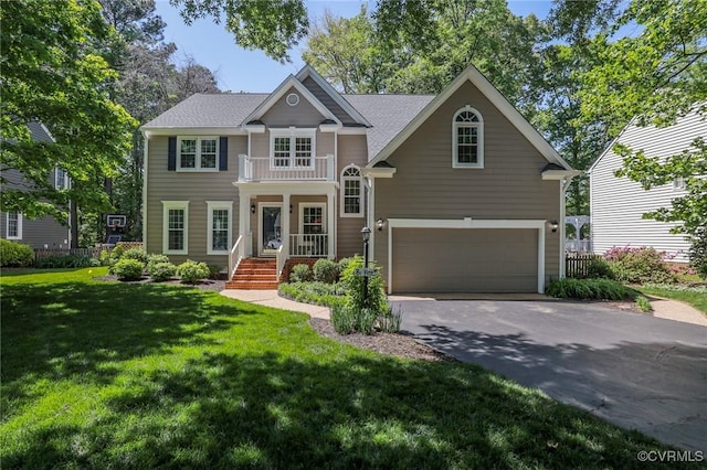 view of front of property with driveway, a front lawn, and a garage