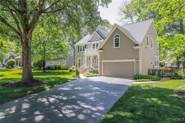 view of front of house with a garage, a front lawn, fence, and concrete driveway