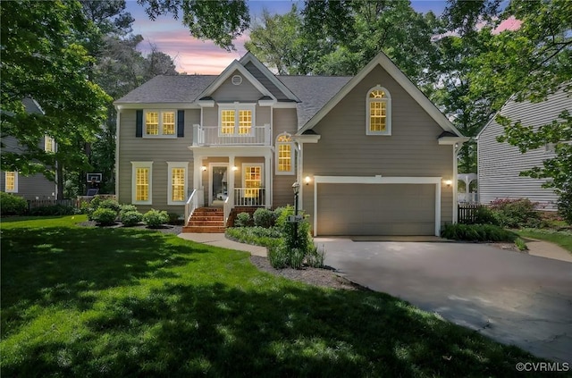 view of front of property featuring an attached garage, a lawn, and concrete driveway