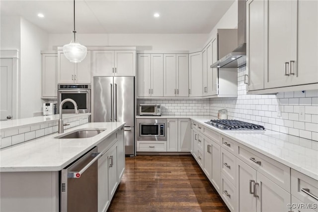 2611 Kensington Ave, Richmond, VA 23220 - kitchen with wall chimney range hood, a sink, light stone countertops, decorative backsplash, and appliances with stainless steel finishes