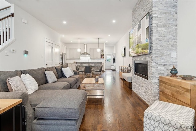 2611 Kensington Ave, Richmond, VA 23220 - living room featuring recessed lighting, a fireplace, stairs, and dark wood-style flooring