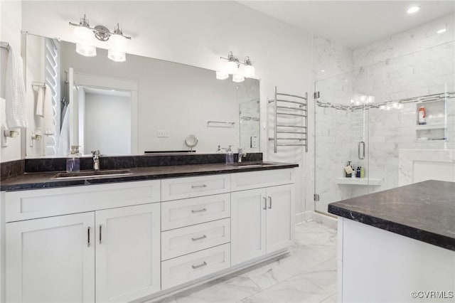 2611 Kensington Ave, Richmond, VA 23220 - full bath with double vanity, a shower stall, marble finish floor, and a sink