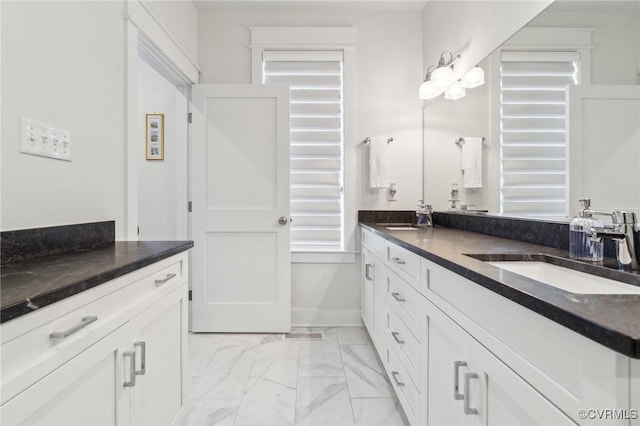 2611 Kensington Ave, Richmond, VA 23220 - bathroom with double vanity, marble finish floor, and a sink