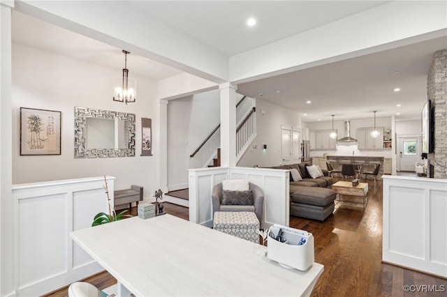 2611 Kensington Ave, Richmond, VA 23220 - dining area featuring recessed lighting, stairs, dark wood-style floors, and a notable chandelier
