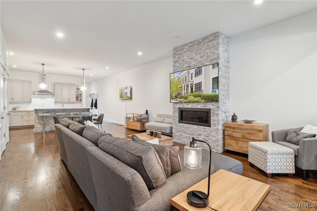 2611 Kensington Ave, Richmond, VA 23220 - living area with recessed lighting, a stone fireplace, and wood finished floors