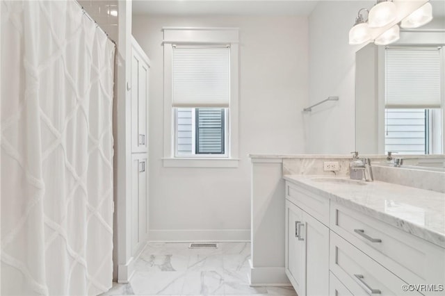 2611 Kensington Ave, Richmond, VA 23220 - full bath featuring vanity, marble finish floor, baseboards, a shower with shower curtain, and visible vents