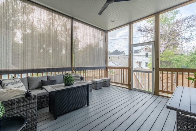 sunroom with an outdoor living space and a ceiling fan