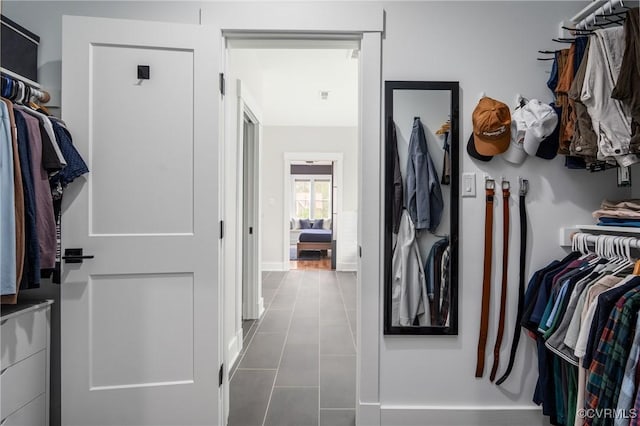 spacious closet featuring tile patterned floors