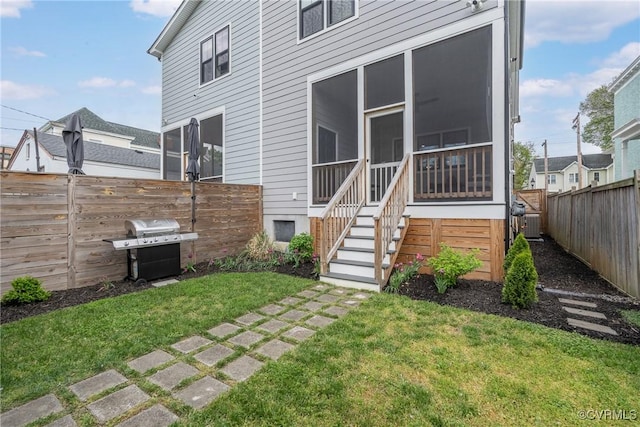 back of house with a sunroom and central AC unit