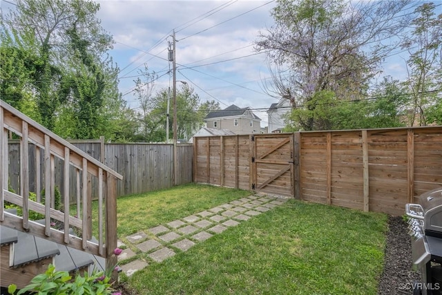 view of yard featuring a gate