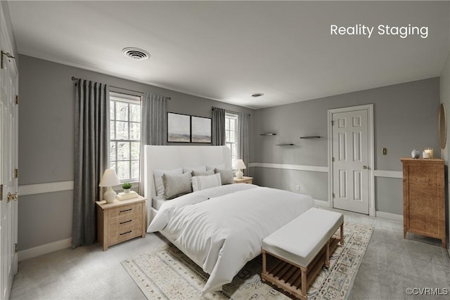 328 Perrow Ln, Manakin Sabot, VA 23103 - bedroom with baseboards, visible vents, multiple windows, and light carpet
