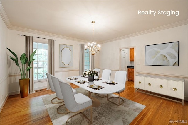 328 Perrow Ln, Manakin Sabot, VA 23103 - dining space featuring ornamental molding, light wood finished floors, and a chandelier