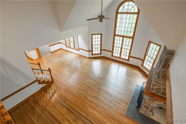 328 Perrow Ln, Manakin Sabot, VA 23103 - unfurnished living room featuring a healthy amount of sunlight, baseboards, a ceiling fan, and wood finished floors