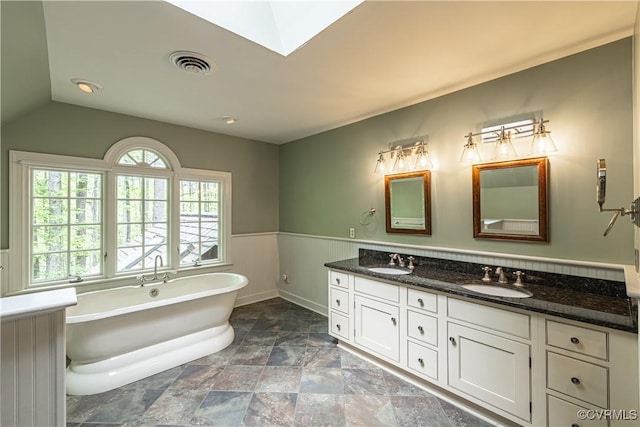 328 Perrow Ln, Manakin Sabot, VA 23103 - full bath featuring a sink, a freestanding tub, double vanity, and visible vents