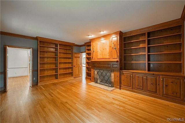 328 Perrow Ln, Manakin Sabot, VA 23103 - unfurnished living room with crown molding, baseboards, light wood finished floors, and built in shelves
