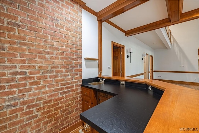 328 Perrow Ln, Manakin Sabot, VA 23103 - bar featuring a sink, baseboards, brick wall, and beam ceiling