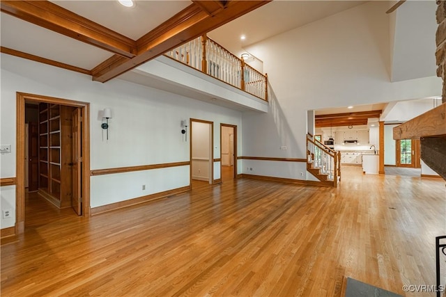328 Perrow Ln, Manakin Sabot, VA 23103 - unfurnished living room with a sink, stairs, baseboards, light wood-type flooring, and beamed ceiling