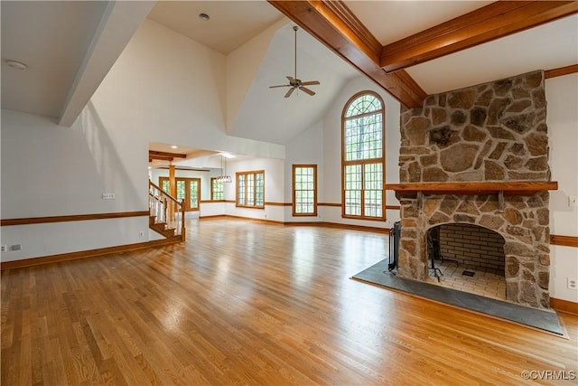 328 Perrow Ln, Manakin Sabot, VA 23103 - unfurnished living room featuring beam ceiling, a stone fireplace, a ceiling fan, baseboards, and wood finished floors