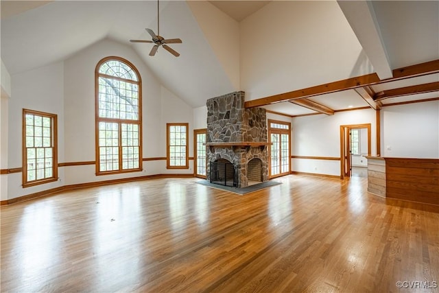 328 Perrow Ln, Manakin Sabot, VA 23103 - unfurnished living room with high vaulted ceiling, a ceiling fan, a stone fireplace, and wood finished floors