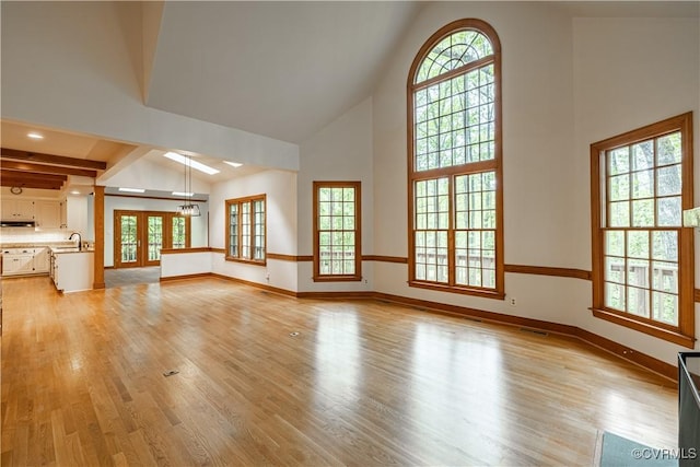 328 Perrow Ln, Manakin Sabot, VA 23103 - unfurnished living room with a sink, high vaulted ceiling, baseboards, and light wood finished floors