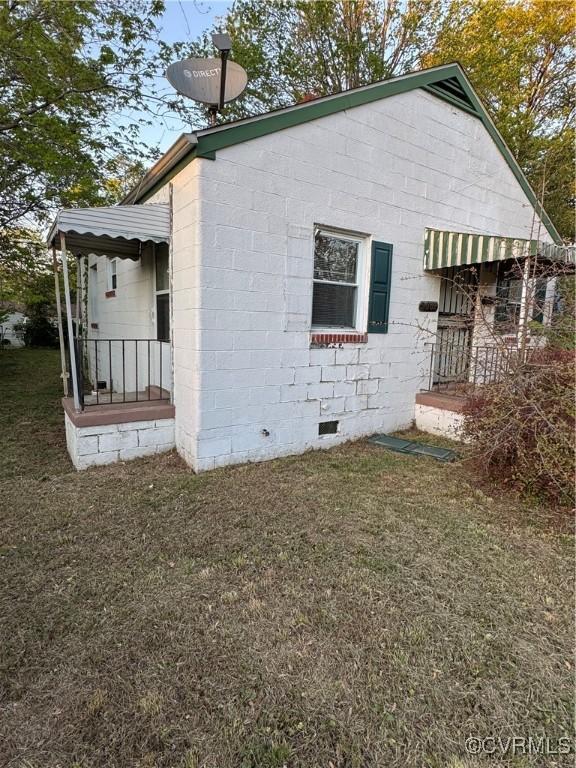 2502 Redwood Ave, Richmond, VA 23223 - view of home's exterior featuring a yard and crawl space