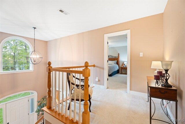 12419 Trumpington Ct, Chesterfield, VA 23838 - hall featuring an upstairs landing, carpet floors, visible vents, baseboards, and a chandelier