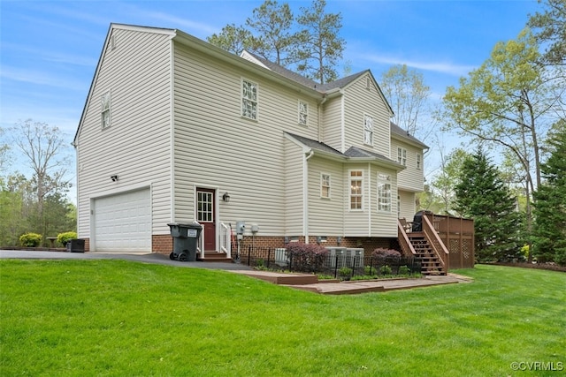 12419 Trumpington Ct, Chesterfield, VA 23838 - rear view of property featuring a garage, a deck, a lawn, stairway, and driveway