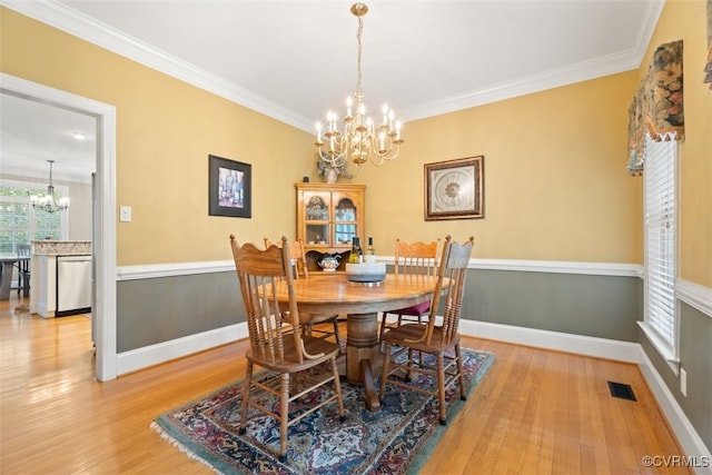 12419 Trumpington Ct, Chesterfield, VA 23838 - dining area with a chandelier, wood finished floors, visible vents, and ornamental molding