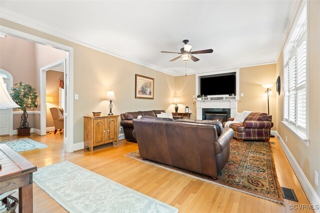 12419 Trumpington Ct, Chesterfield, VA 23838 - living room featuring visible vents, wood finished floors, ceiling fan, and a glass covered fireplace
