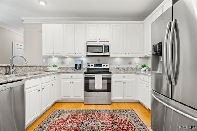 12419 Trumpington Ct, Chesterfield, VA 23838 - kitchen featuring white cabinetry, stainless steel appliances, ornamental molding, and a sink