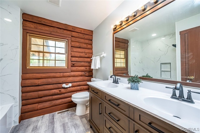 6631 Rural Point Rd, Mechanicsville, VA 23116 - bathroom featuring log walls, double vanity, toilet, wood finished floors, and a combined bath / shower with marble appearance