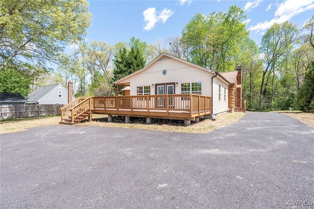 6631 Rural Point Rd, Mechanicsville, VA 23116 - view of front of house with a chimney, a deck, and french doors