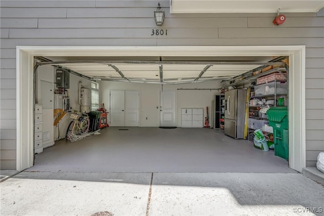 3801 Duckling Walk, Glen Allen, VA 23060 - garage featuring stainless steel refrigerator with ice dispenser