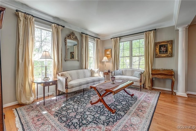 3801 Duckling Walk, Glen Allen, VA 23060 - living room featuring ornate columns, light wood-style floors, baseboards, and ornamental molding