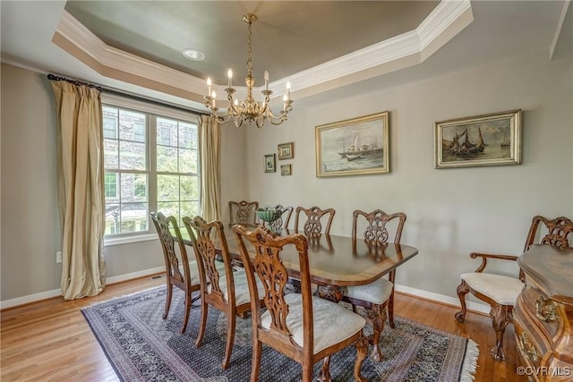 3801 Duckling Walk, Glen Allen, VA 23060 - dining space with crown molding, a raised ceiling, a chandelier, light wood-type flooring, and baseboards