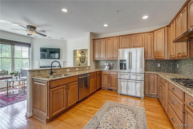 3801 Duckling Walk, Glen Allen, VA 23060 - kitchen with stainless steel appliances, a sink, light wood finished floors, light stone countertops, and ceiling fan