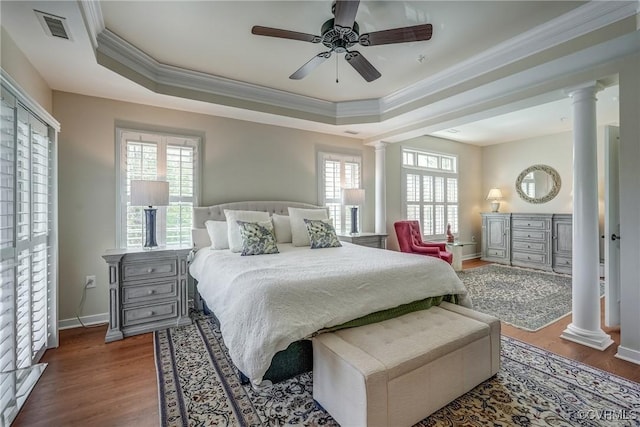 3801 Duckling Walk, Glen Allen, VA 23060 - bedroom with decorative columns, ornamental molding, a tray ceiling, wood finished floors, and baseboards