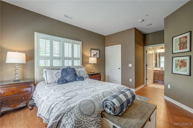 3801 Duckling Walk, Glen Allen, VA 23060 - bedroom with multiple windows, light wood-type flooring, and baseboards