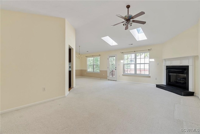 14530 Hancock Ridge Ct, Chesterfield, VA 23832 - unfurnished living room with a fireplace with raised hearth, a skylight, light carpet, ceiling fan, and baseboards