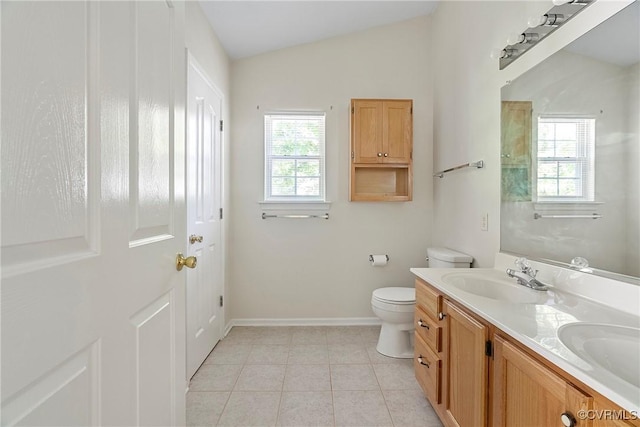 14530 Hancock Ridge Ct, Chesterfield, VA 23832 - full bath featuring toilet, vaulted ceiling, double vanity, baseboards, and tile patterned flooring