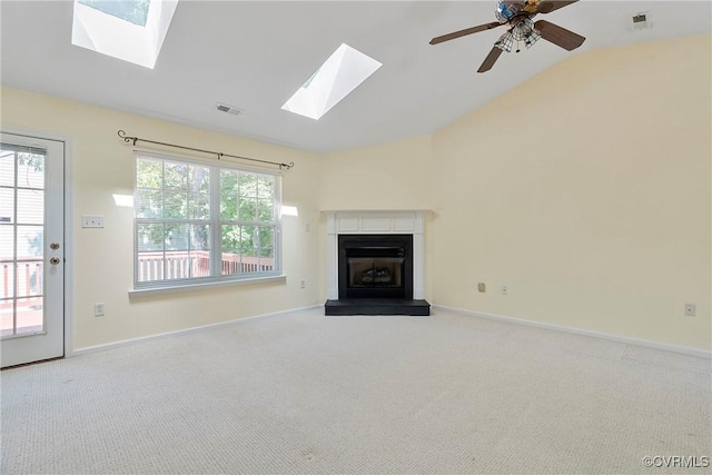 14530 Hancock Ridge Ct, Chesterfield, VA 23832 - unfurnished living room featuring a skylight, lofted ceiling, carpet floors, a fireplace with raised hearth, and baseboards