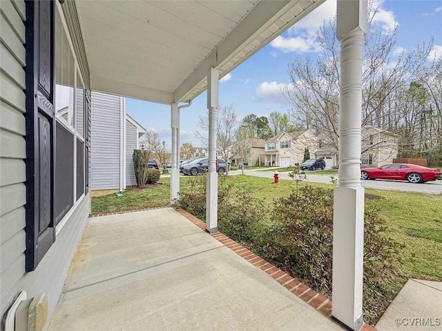 view of patio / terrace with a porch and a residential view
