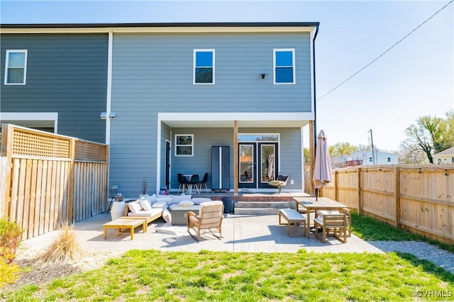 300 W 25th St, Richmond, VA 23225 - rear view of house with a fenced backyard and a patio