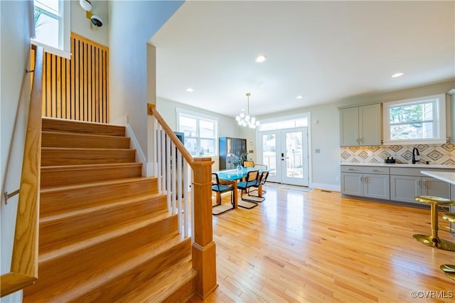 300 W 25th St, Richmond, VA 23225 - stairway with recessed lighting, wood finished floors, a wealth of natural light, and french doors