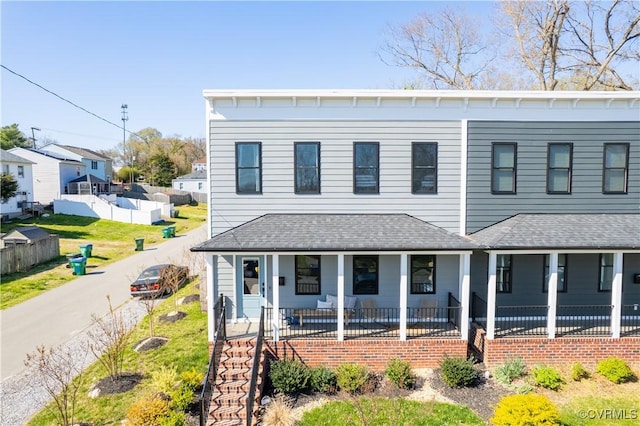 300 W 25th St, Richmond, VA 23225 - view of front of house featuring fence, covered porch, and roof with shingles