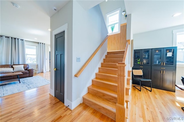 300 W 25th St, Richmond, VA 23225 - stairs with baseboards, wood finished floors, and a wealth of natural light